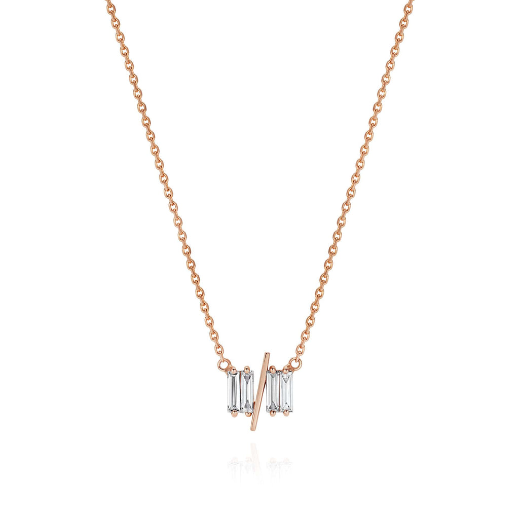 11/11 necklace in rose gold - featuring a thin rose gold chain, 4 long thin diamonds, with a thin diagonal gold bar, to make the ‘11/11’ symbol.