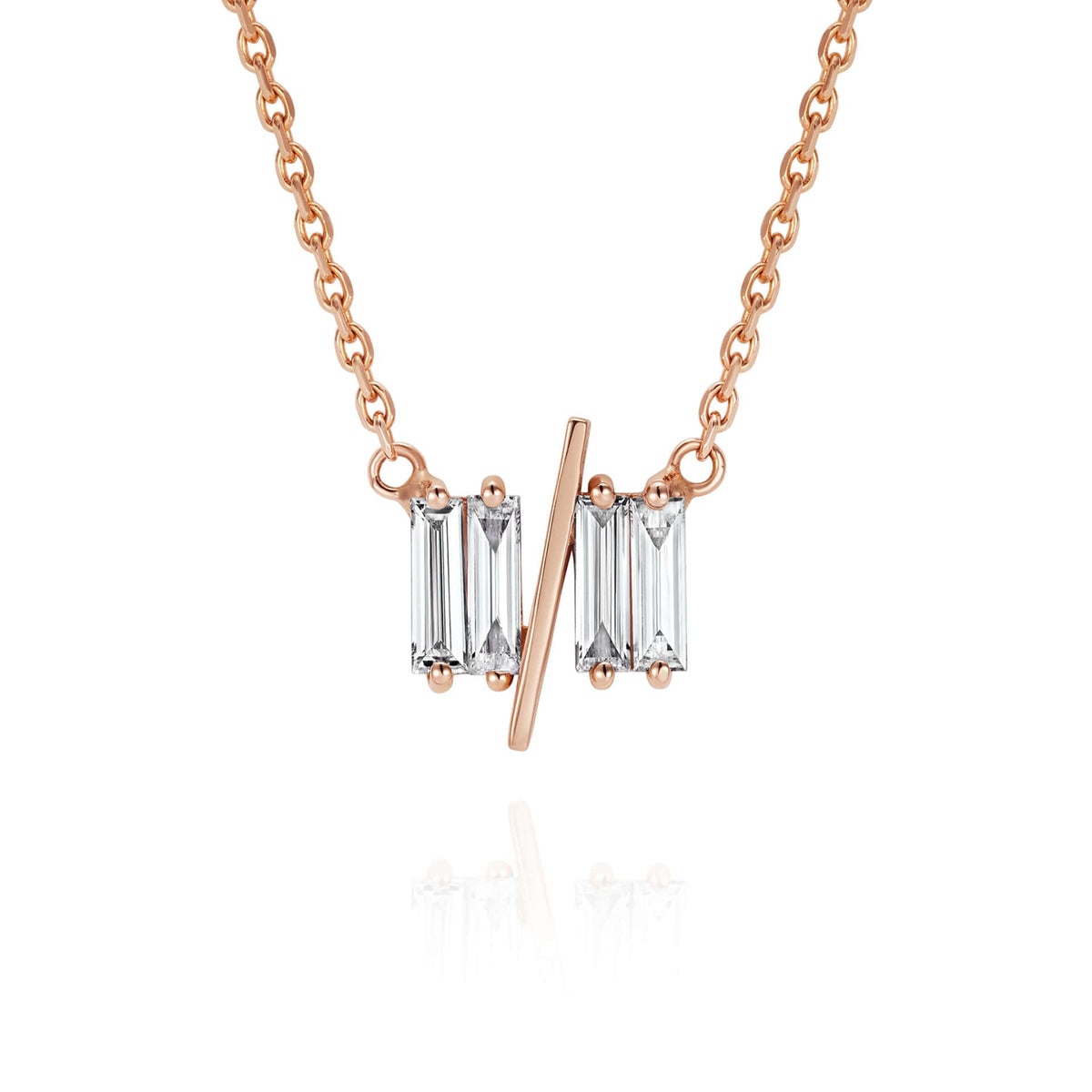 Close up of 11/11 necklace in rose gold - featuring a thin rose gold chain, 4 long thin diamonds, with a thin diagonal gold bar, to make the ‘11/11’ symbol.
