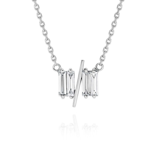 Close up of 11/11 necklace in white gold - featuring a thin white gold chain, 4 long thin diamonds, with a thin diagonal gold bar, to make the ‘11/11’ symbol.