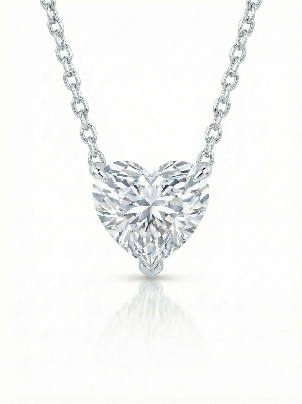Heart-shaped diamond pendant on a white background