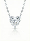 Heart-shaped diamond pendant on a white background