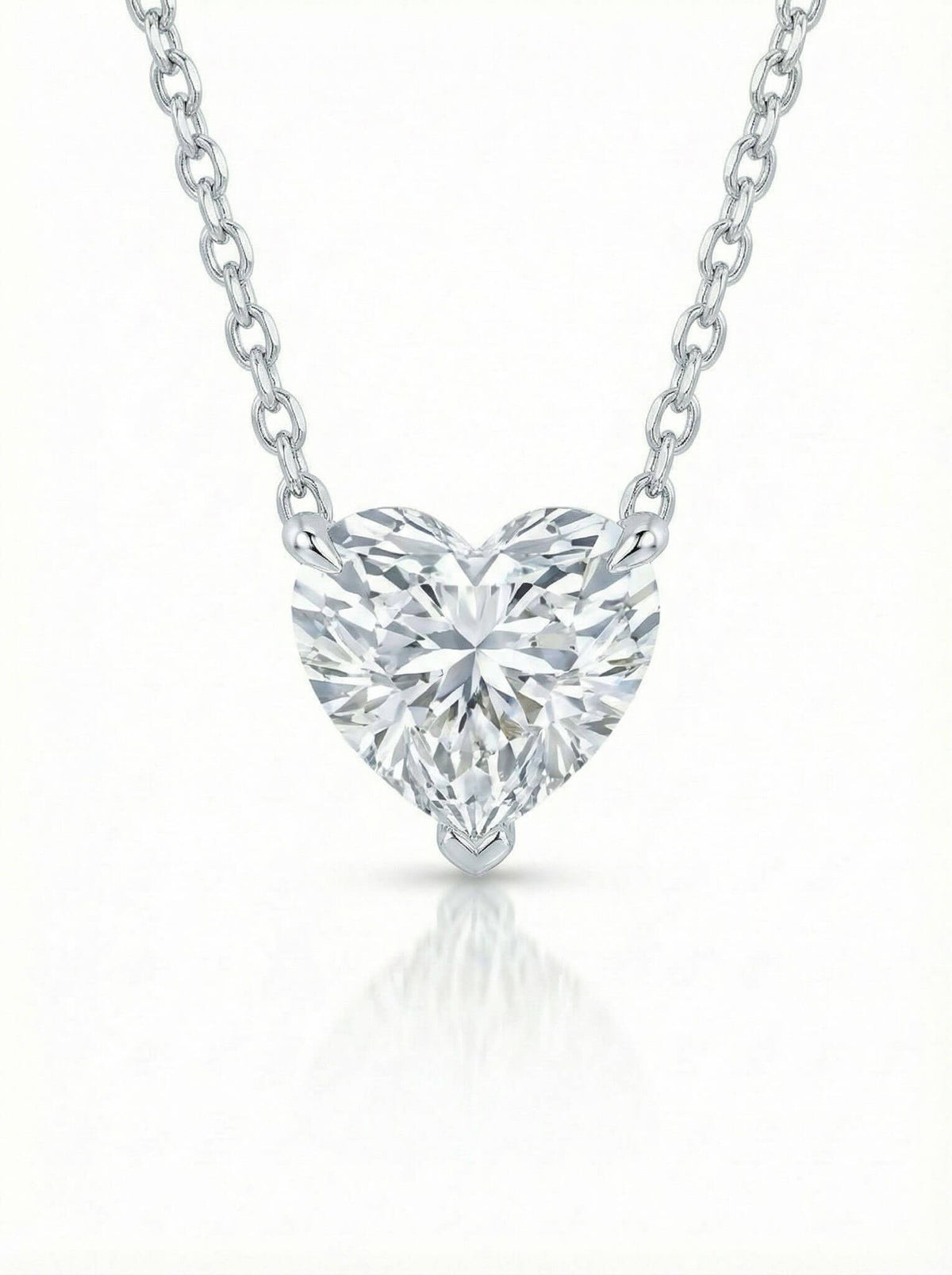 Heart-shaped diamond pendant on a white background