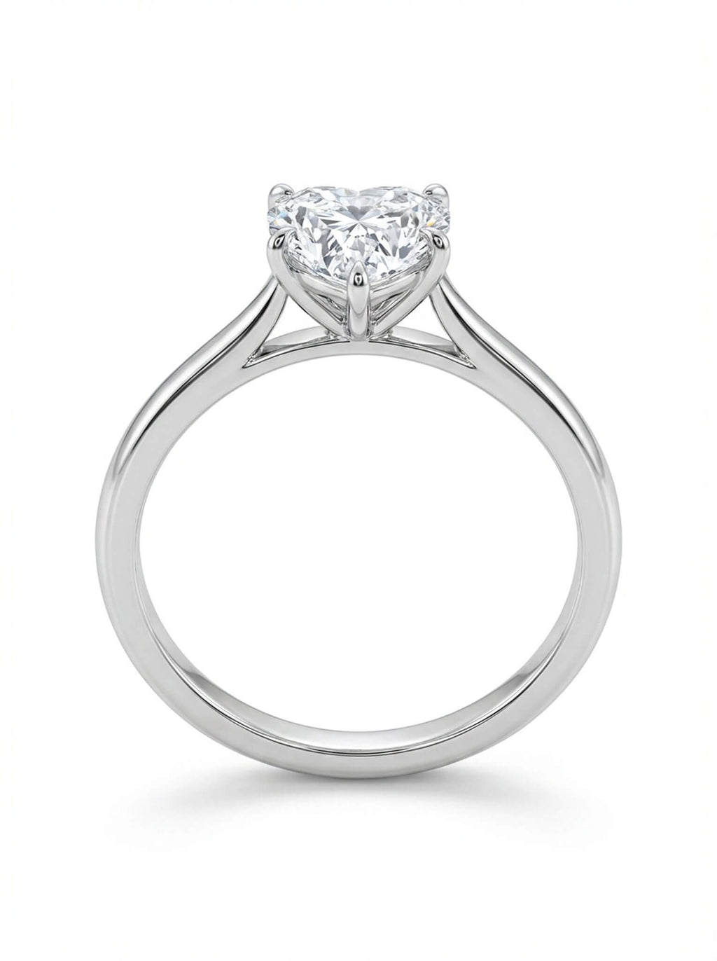Diamond ring with a heart-shaped center stone on a white background