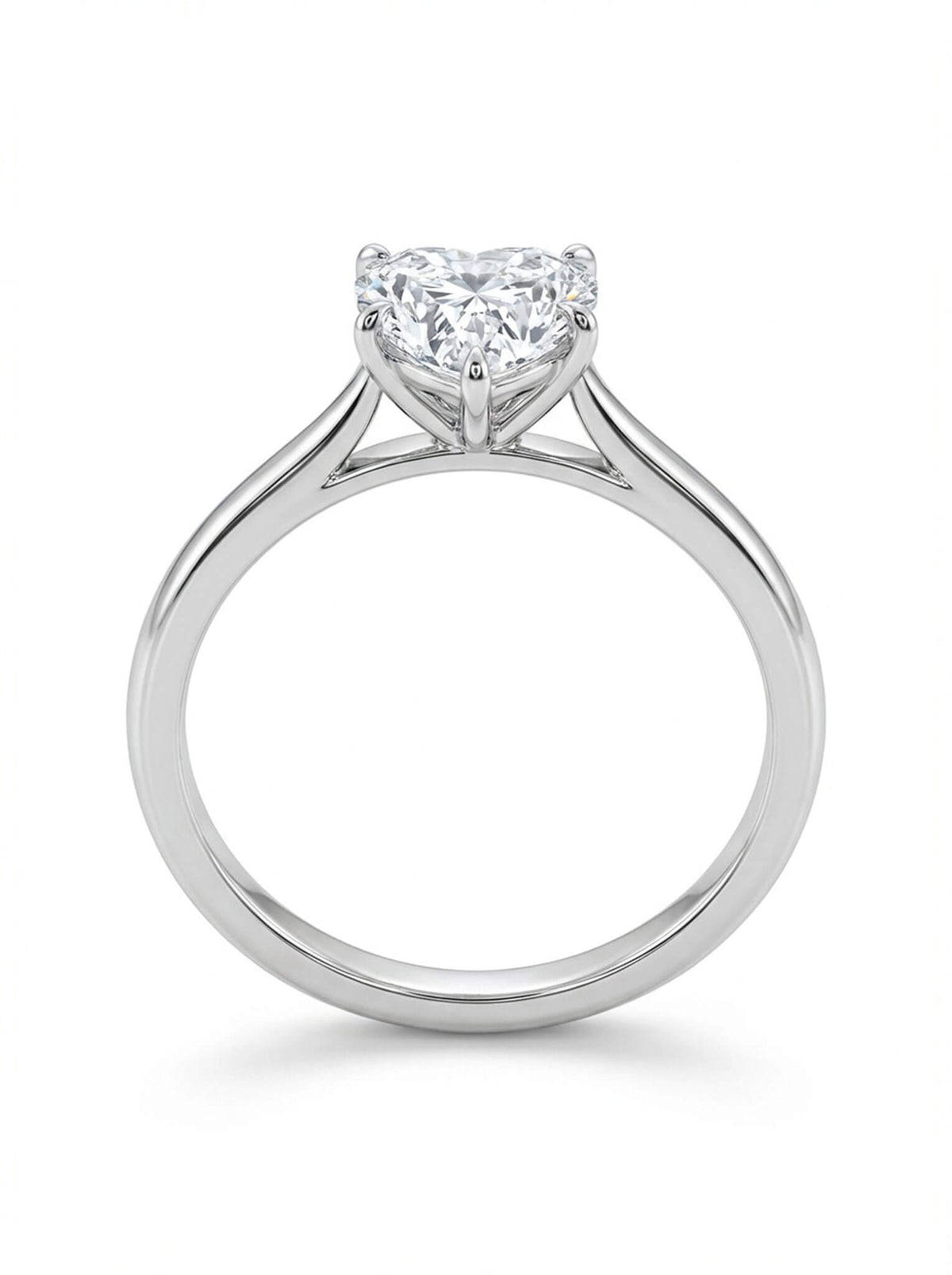 Diamond ring with a heart-shaped center stone on a white background